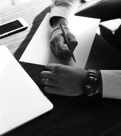 person writing on white paper